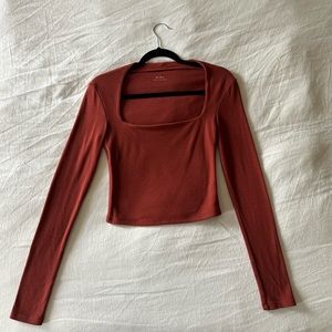 OGL burnt orange double-lined fleece cropped long-sleeve top. Size small.